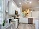 Well-appointed kitchen with quartz counters, stainless appliances, and convenient layout for cooking and entertaining at 15856 Cobble Mill Dr, Wimauma, FL 33598