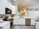 Well-appointed kitchen with quartz counters, stainless appliances, and convenient access to other living spaces at 15856 Cobble Mill Dr, Wimauma, FL 33598