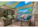 Inviting outdoor patio area featuring comfortable wicker seating and views of the community pool at 15856 Cobble Mill Dr, Wimauma, FL 33598