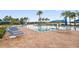 Relaxing community pool with ample seating and clear blue water at 15856 Cobble Mill Dr, Wimauma, FL 33598