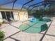 Inviting screened-in pool and hot tub with lounge chairs, perfect for relaxing and entertaining at 16103 Muirfield Dr, Odessa, FL 33556