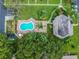 Aerial view of the pool, landscaping, parking, and clubhouse at 1601 43Rd N St # 133, St Petersburg, FL 33713