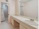 Bathroom featuring an extended vanity with a large mirror and walk-in shower at 1601 43Rd N St # 133, St Petersburg, FL 33713