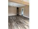 Open living room featuring hardwood floors, a view of the entryway and ceiling light fixture at 3307 N Morgan St, Tampa, FL 33603