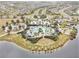 Overhead view of the community clubhouse, pool, playground, and other amenities, nestled by a serene lake at 8463 Canyon Creek Trl, Parrish, FL 34219
