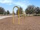 Community playground with swings and recreational equipment at 8463 Canyon Creek Trl, Parrish, FL 34219