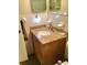 Bathroom features a vanity with a light brown granite counter and stainless steel faucet at 2060 Marilyn St # 133, Clearwater, FL 33765