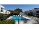 View of the community pool and surrounding lounge chairs at 2060 Marilyn St # 133, Clearwater, FL 33765