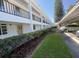 Two-story condo with covered parking, landscaping, and well-maintained grounds at 2060 Marilyn St # 133, Clearwater, FL 33765