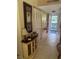 Inviting hallway with tiled floors and closet with decor at 2060 Marilyn St # 133, Clearwater, FL 33765