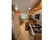 Functional kitchen with wood cabinetry and white appliances at 2060 Marilyn St # 133, Clearwater, FL 33765
