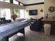 Bright living room with ample natural light, comfortable seating, and a flat-screen TV at 2060 Marilyn St # 133, Clearwater, FL 33765