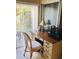 Bright office space with a wooden desk, chair, and natural light creating a productive environment at 2060 Marilyn St # 133, Clearwater, FL 33765