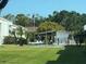 Community pool area with a covered pavilion and manicured landscaping at 2060 Marilyn St # 133, Clearwater, FL 33765