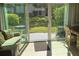 Bright sunroom with patio access and comfortable seating at 2060 Marilyn St # 133, Clearwater, FL 33765