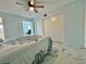 Bedroom featuring a view, light blue walls, a ceiling fan, and sliding closet doors at 2311 Brisbane St # 65, Clearwater, FL 33763