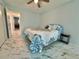Well-lit bedroom featuring marble tile flooring, a full-sized bed, and light blue painted walls at 2311 Brisbane St # 65, Clearwater, FL 33763