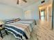 Bright bedroom features a ceiling fan, marble floor, and closet at 2311 Brisbane St # 65, Clearwater, FL 33763
