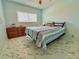 Bedroom features a large window, marble flooring, and a neutral color scheme at 2311 Brisbane St # 65, Clearwater, FL 33763