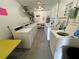 Bright community laundry room with several commercial washing machines and dryers for resident use at 2311 Brisbane St # 65, Clearwater, FL 33763