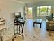 Living room with marble floors, view of balcony, dining table and chairs at 2311 Brisbane St # 65, Clearwater, FL 33763