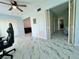 Open living space with marble tile floors, modern fixtures, and neutral paint at 2311 Brisbane St # 65, Clearwater, FL 33763
