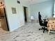 Living space featuring a view, marble tile flooring, a refrigerator, and access to other rooms at 2311 Brisbane St # 65, Clearwater, FL 33763