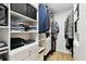 Spacious walk-in closet with custom shelving and organization at 2335 Heron Cir, Clearwater, FL 33762