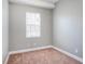 Simple bedroom design with neutral walls, plush carpeting, and a window with blinds at 2419 Victoria Gardens Ln, Tampa, FL 33609
