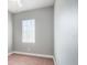 Cozy bedroom with neutral walls, plush carpeting, a ceiling fan and a window with blinds at 2419 Victoria Gardens Ln, Tampa, FL 33609