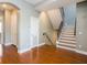 Entryway features hardwood floors, staircase and access to multiple rooms at 2419 Victoria Gardens Ln, Tampa, FL 33609