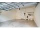 Spacious and well-lit private garage, with a large door and clean, functional storage at 2419 Victoria Gardens Ln, Tampa, FL 33609
