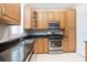 Well-equipped kitchen with granite countertops, stainless steel appliances, and ample cabinet space at 2419 Victoria Gardens Ln, Tampa, FL 33609