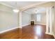 Elegant living area with hardwood floors, decorative columns, and a cozy fireplace at 2419 Victoria Gardens Ln, Tampa, FL 33609