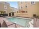 Relaxing community pool featuring easy stair access and a surrounding brick patio, great for lounging at 2419 Victoria Gardens Ln, Tampa, FL 33609