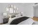 Well decorated bedroom featuring wood floors, a grey color scheme, and a comfortable bed at 2730 5Th Ct, Palm Harbor, FL 34684