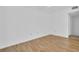 Bright bedroom features wood floors, white walls, and natural lighting at 2730 5Th Ct, Palm Harbor, FL 34684