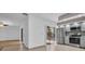 Bright and airy living area adjacent to a modern kitchen, with patio access, offering seamless indoor-outdoor living at 2730 5Th Ct, Palm Harbor, FL 34684