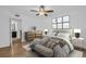 An elegant main bedroom with a neutral color palette, hardwood floors, and ample natural light at 2730 5Th Ct, Palm Harbor, FL 34684