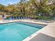 A community pool with cool blue water, deck chairs, and a jacuzzi at 2730 5Th Ct, Palm Harbor, FL 34684