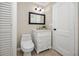 Cozy bathroom featuring a white vanity with framed mirror and a modern toilet at 6923 Dartmouth N Ave, St Petersburg, FL 33710