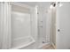 Bright bathroom featuring a shower and tub combo with white tile surround at 6923 Dartmouth N Ave, St Petersburg, FL 33710
