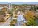 This aerial view showcases a cozy neighborhood featuring tree-lined streets and a vintage water tower at 8501 47Th N St, Pinellas Park, FL 33781