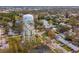 A neighborhood aerial view showcasing a charming home near a pond with nearby Park water tower at 8501 47Th N St, Pinellas Park, FL 33781