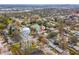 A neighborhood aerial view showcasing a charming home near a pond with nearby Park water tower at 8501 47Th N St, Pinellas Park, FL 33781