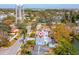 This aerial view showcases a cozy neighborhood featuring tree-lined streets and a vintage water tower at 8501 47Th N St, Pinellas Park, FL 33781