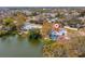 Lovely waterfront home features mature trees, a private deck, and access to the serene lake at 8501 47Th N St, Pinellas Park, FL 33781