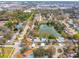 Expansive aerial shot shows a waterfront home nestled in a mature neighborhood with tree-lined streets at 8501 47Th N St, Pinellas Park, FL 33781
