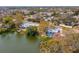 Lovely waterfront home features mature trees, a private deck, and access to the serene lake at 8501 47Th N St, Pinellas Park, FL 33781