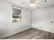 Bedroom with luxury vinyl plank flooring and ceiling fan at 8501 47Th N St, Pinellas Park, FL 33781